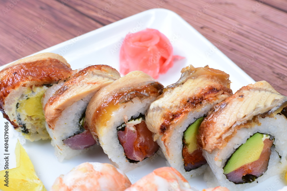 Traditional colorful suhi, cream cheese, salmon, caviar, rool sishi crunch, sesame seeds and sauce Traditional colorful suhi, cream cheese, salmon, caviar, rool sishi crunch, sesame seeds and sauce