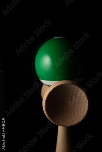 Kendama is a traditional Japanese skill toy. It consists of a handle (ken), a pair of cups (sarado), and a ball (tama) that are all connected together by a string photo