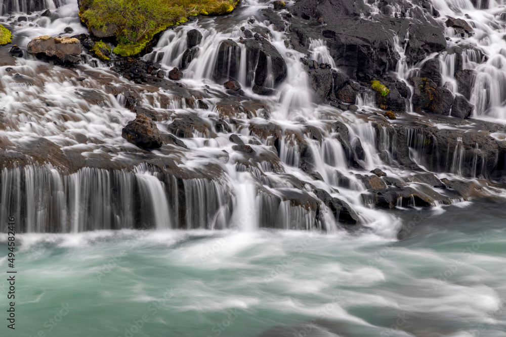 Hraunfossar is unique water falls in Iceland water flows under lava stones. Hraunfossar is unique water falls in Iceland water flows under lava stones.