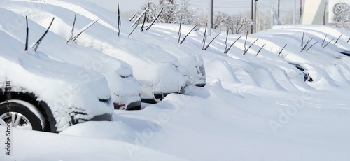 Cars at a car dealership in Indianapolis, Indiana, USA, are seen after a heavy winter snowfall with wipers up so the snow can be easily cleaned away.