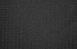 The texture of nylon black fabric.Synthetic black nylon fabric. The background is nylon black.