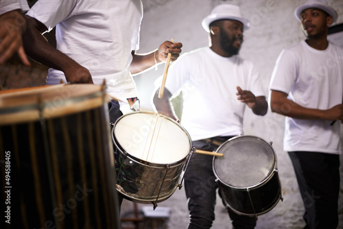 Feel the rhythm of the carnival. Shot of a band playing their percussion instruments in a Brazilian setting.