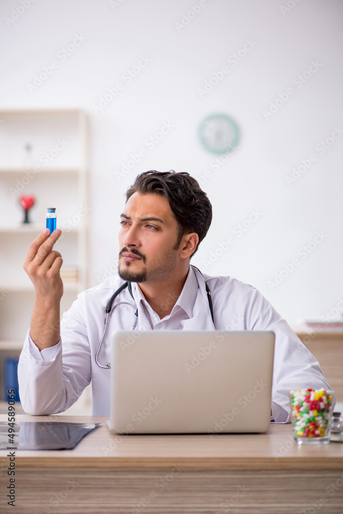 Young male doctor working in the clinic Young male doctor working in the clinic