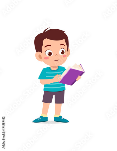 little kid standing and reading a story book