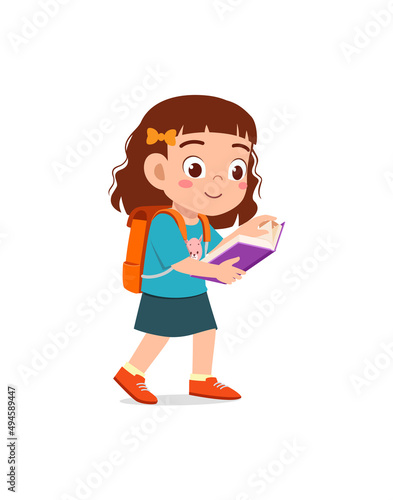 little kid standing and reading a story book