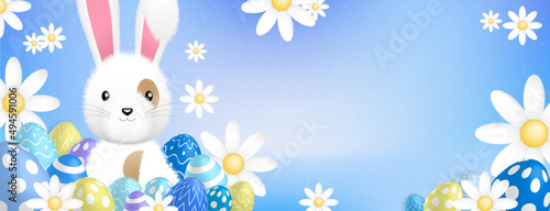a cute white rabbit behind colored eggs and flowers on a blue background