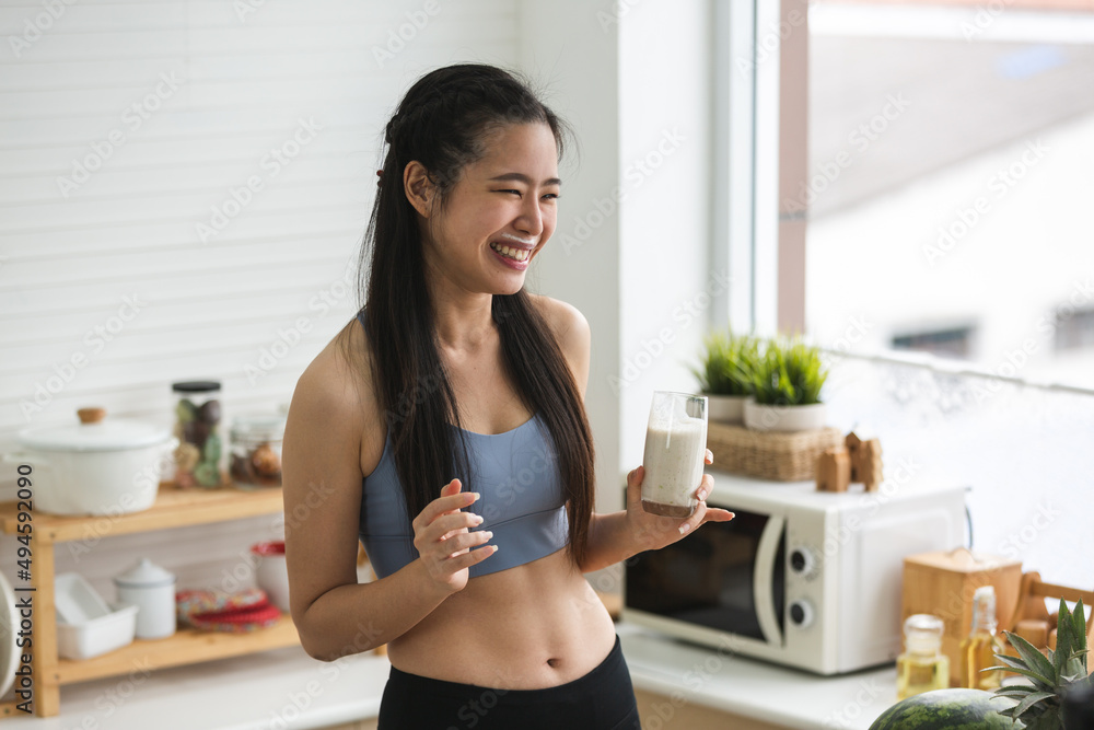 young Asian woman person cooking in kitchen with a healthy food concept, drink and organic vegetable young Asian woman person cooking in kitchen with a healthy food concept, drink and organic vegetable