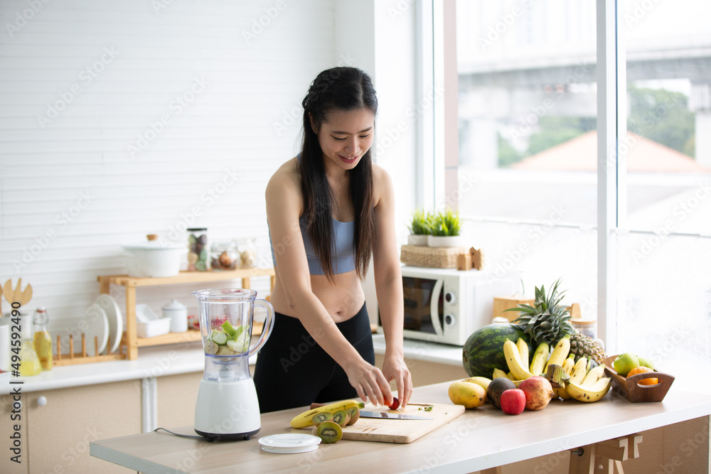 young Asian woman person cooking in kitchen with a healthy food concept, drink and organic vegetable young Asian woman person cooking in kitchen with a healthy food concept, drink and organic vegetable