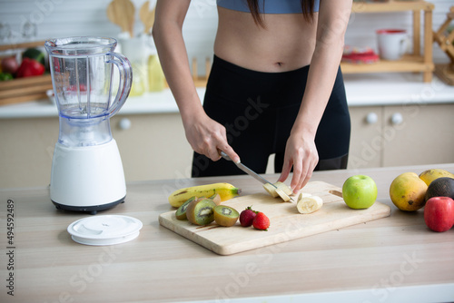 young Asian woman person cooking in kitchen with a healthy food concept  drink and organic vegetable
