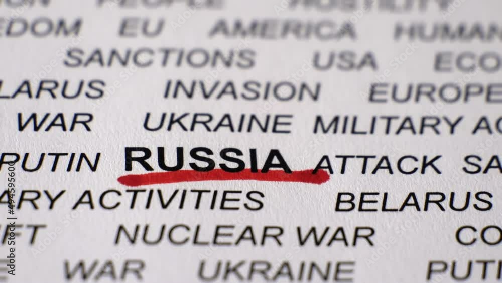 Closeup shot of RUSSIA written on white paper with a red line. Military activities. Sanctions. Crisis. Russian invasion of Ukraine concept. Camera moving forward and sideways. Closeup shot of RUSSIA written on white paper with a red line. Military activities. Sanctions. Crisis. Russian invasion of Ukraine concept. Camera moving forward and sideways.