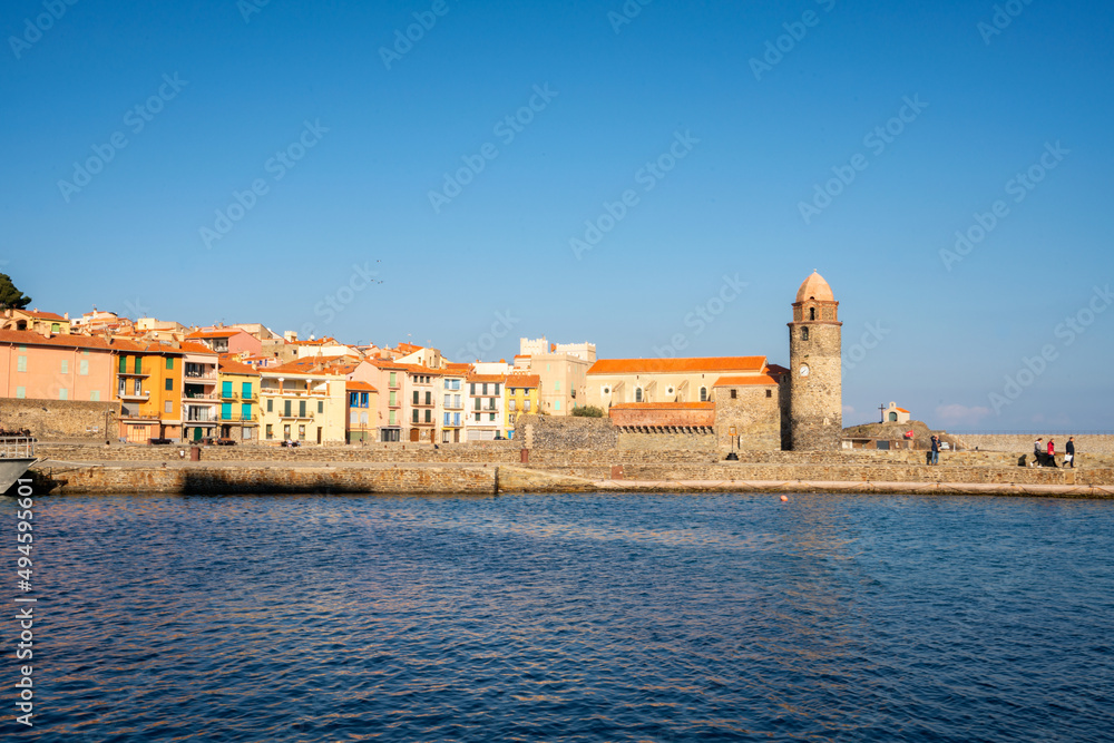 View of Collioure Church of Our Lady of the Angels and traditional colorful buildings in the south of France