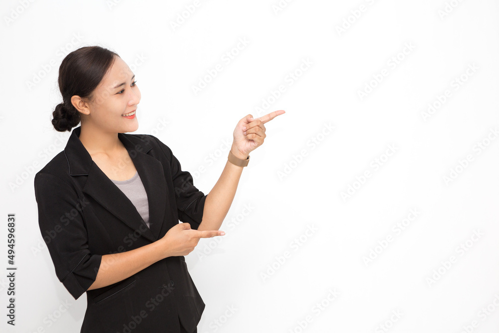 Beautiful Asian business woman wearing black suit presenting something on white background and copy space. Confident Asian working woman smiling and cheerful Beautiful Asian business woman wearing black suit presenting something on white background and copy space. Confident Asian working woman smiling and cheerful