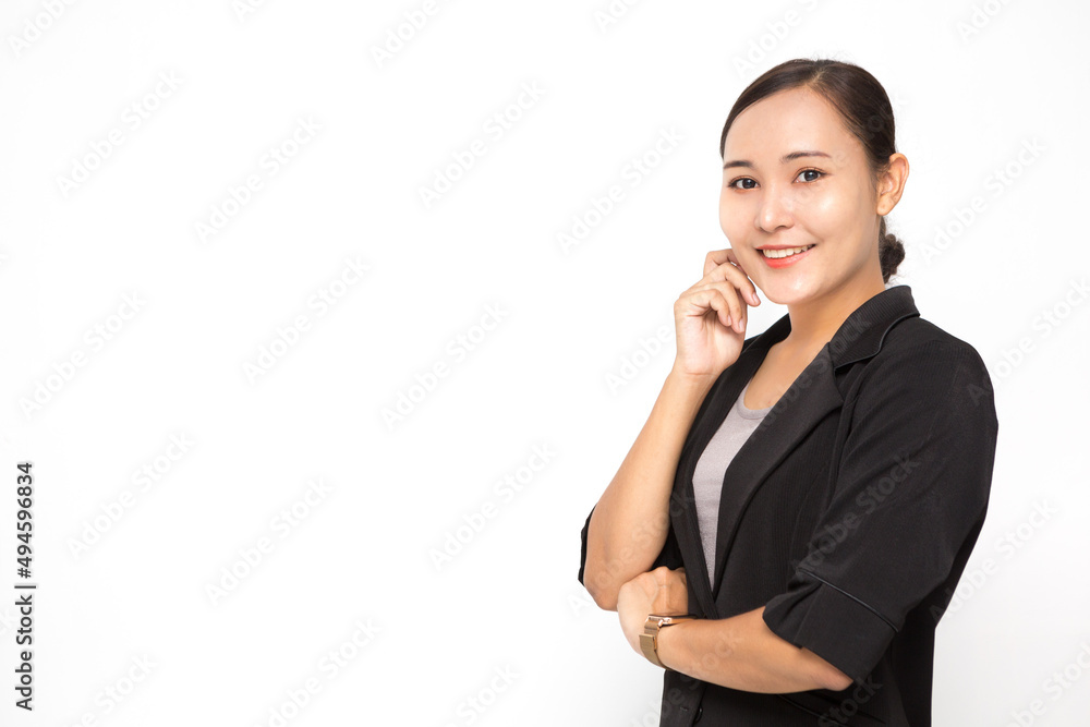 Beautiful Asian business woman wearing black suit with her crossed arms on white background and copy space. Confident Asian working woman smiling and cheerful Beautiful Asian business woman wearing black suit with her crossed arms on white background and copy space. Confident Asian working woman smiling and cheerful