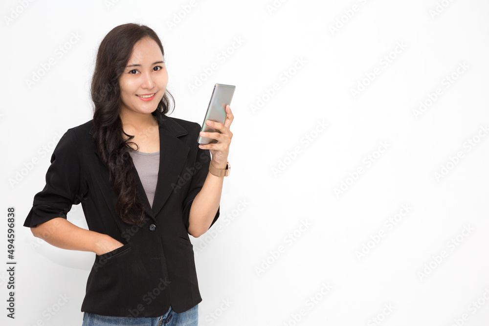 Beautiful Asian business woman wearing black suit holding smartphone on white background and copy space. Confident Asian working woman smiling and cheerful Beautiful Asian business woman wearing black suit holding smartphone on white background and copy space. Confident Asian working woman smiling and cheerful