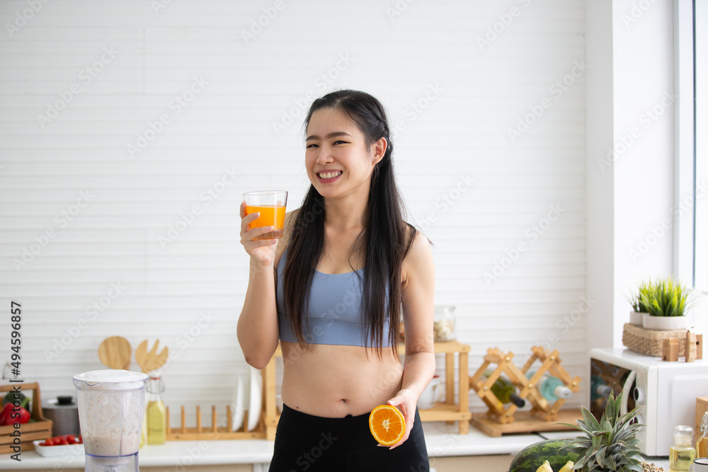 young Asian woman person cooking in kitchen with a healthy food concept, drink and organic vegetable young Asian woman person cooking in kitchen with a healthy food concept, drink and organic vegetable