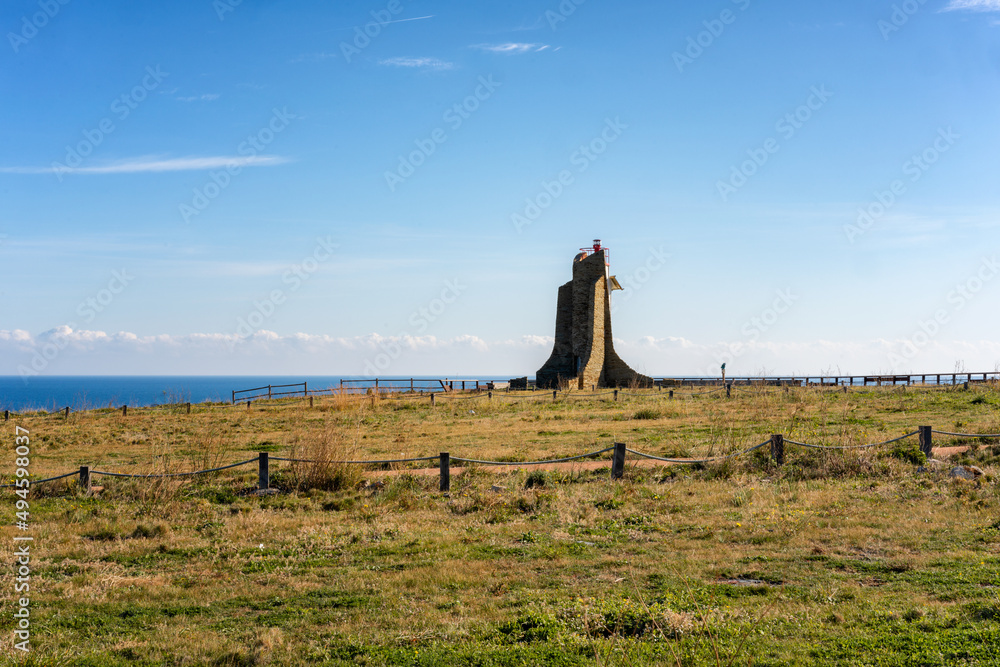 Obraz premium Lighthouse of the Cap Cerbere in the border between Spain and France with the atlantic ocean on the background
