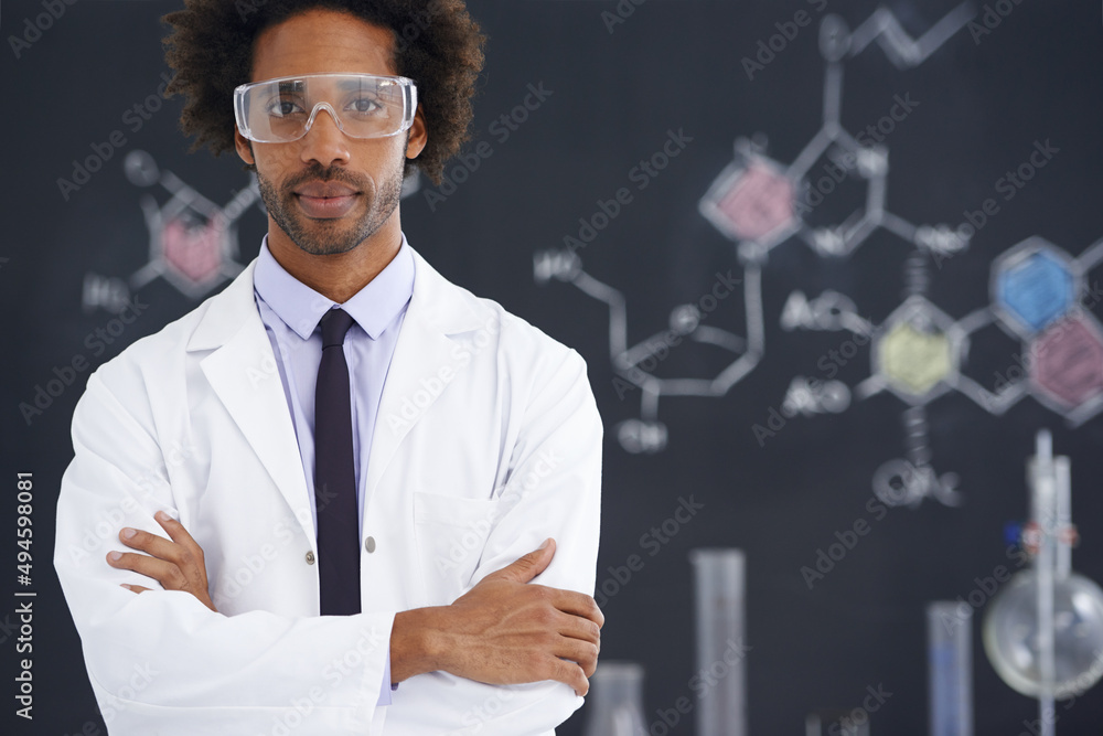 Hes always had an analytical mind. A male scientist standing in front of a blackboard filled with drawings of chemical bonds. Hes always had an analytical mind. A male scientist standing in front of a blackboard filled with drawings of chemical bonds.