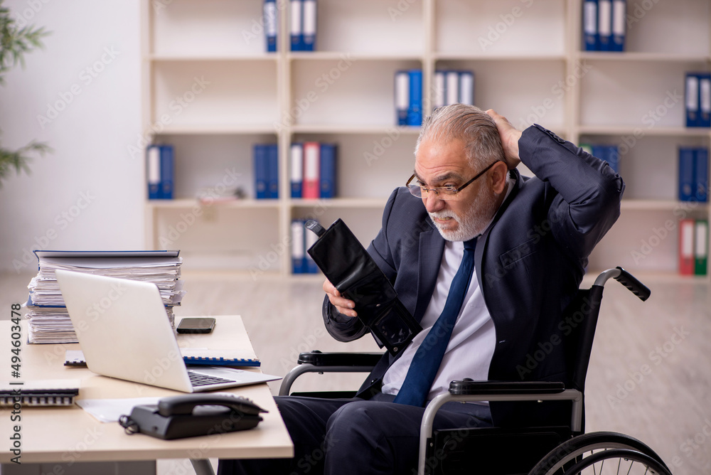 Old injured male employee in remuneration concept Old injured male employee in remuneration concept