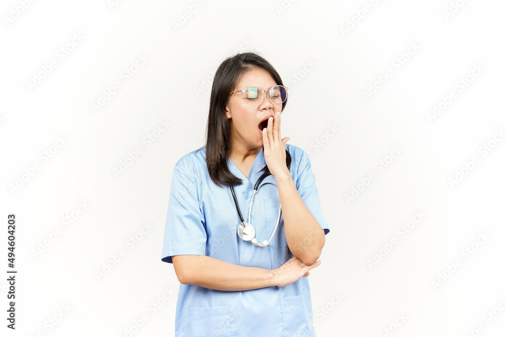 Yawning Of Asian Young Doctor Isolated On White Background Yawning Of Asian Young Doctor Isolated On White Background