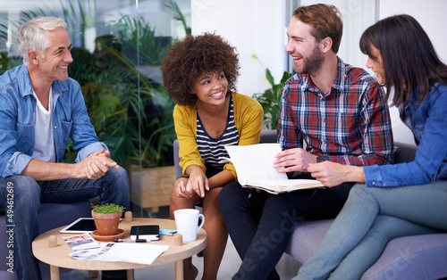 Feeling good about this team. Shot of a group of happy coworkers in a meeting.