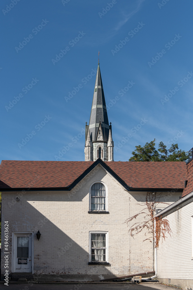 Shorter Building in Front of a Church Steeple Shorter Building in Front of a Church Steeple