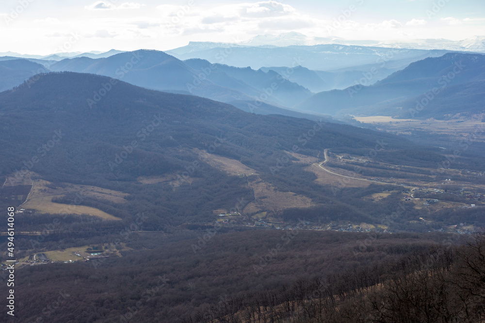 Fototapeta premium Winter mountain landscape on a sunny day, without snow cover, on observation decks.