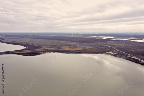 steppe plain landscape lake in the middle of fields