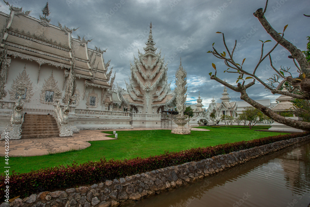 background Wat Rong Khun The White Temple and pond with fish, in Chiang Rai, Thailand background Wat Rong Khun The White Temple and pond with fish, in Chiang Rai, Thailand