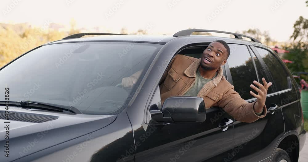 Angry black driver behind the wheel of a car Angry black driver behind the wheel of a car
