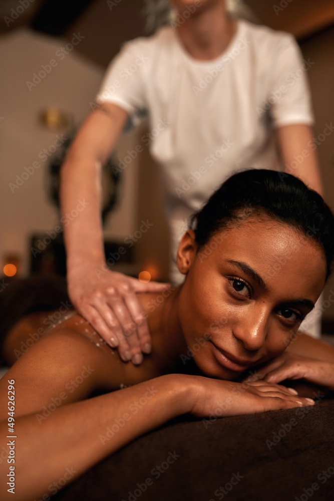 Masseur smear salt on black girl back during scrub Masseur smear salt on black girl back during scrub