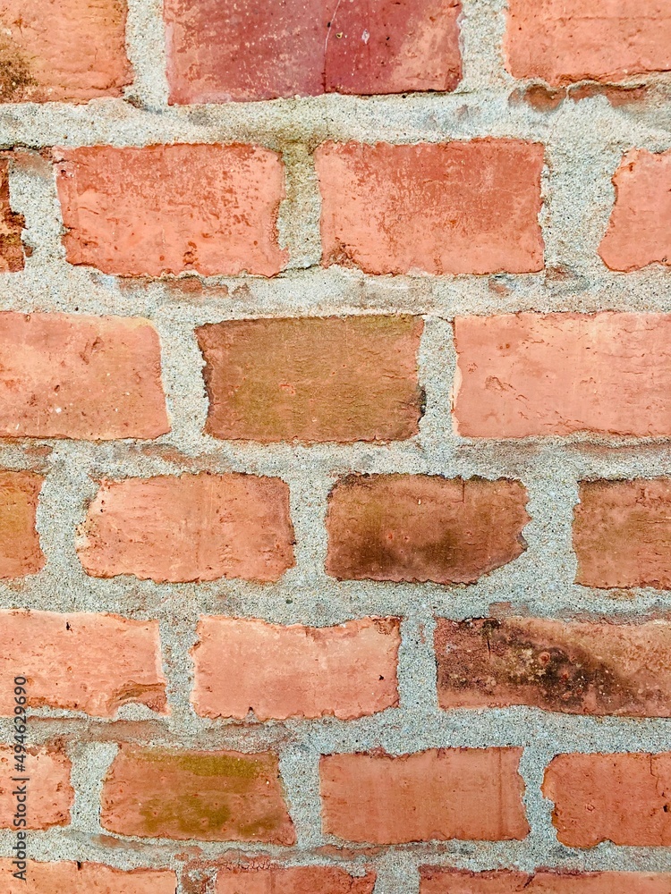 A wall made of red old bricks A wall made of red old bricks