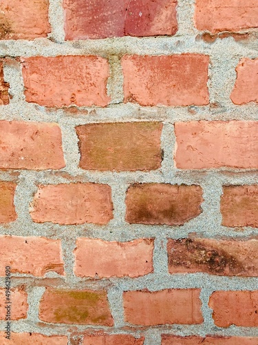 A wall made of red old bricks 
