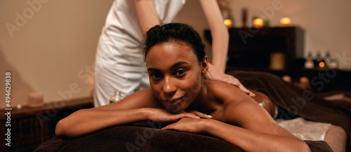 Masseur doing back massage of woman in spa salon © Svitlana