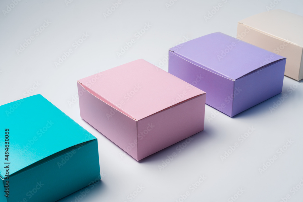 Pile of colorful cardboard boxes on white background Pile of colorful cardboard boxes on white background