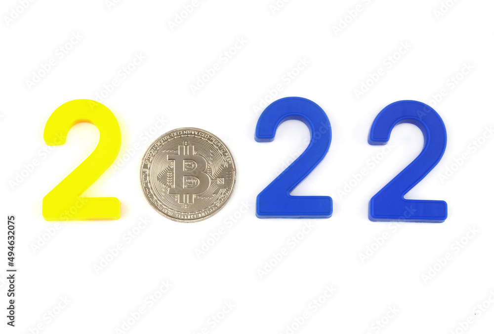 Bitcoin in year 2022 concept. Bitcoin coin and numbers 2022 isolated on white. 