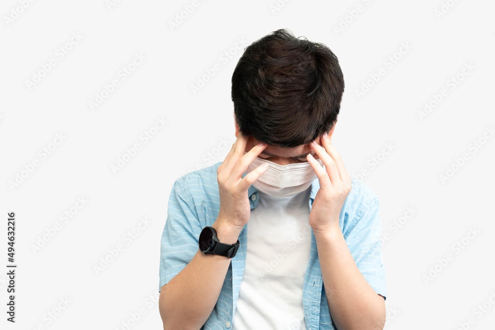 Teen Mental Health During COVID-19 concept. Portrait of an asian teenager boy with medical face mask, face down hands cover his face. Stressful, Anxiety, Illness, Infected, Cyberbully, Pandemic. Teen Mental Health During COVID-19 concept. Portrait of an asian teenager boy with medical face mask, face down hands cover his face. Stressful, Anxiety, Illness, Infected, Cyberbully, Pandemic.