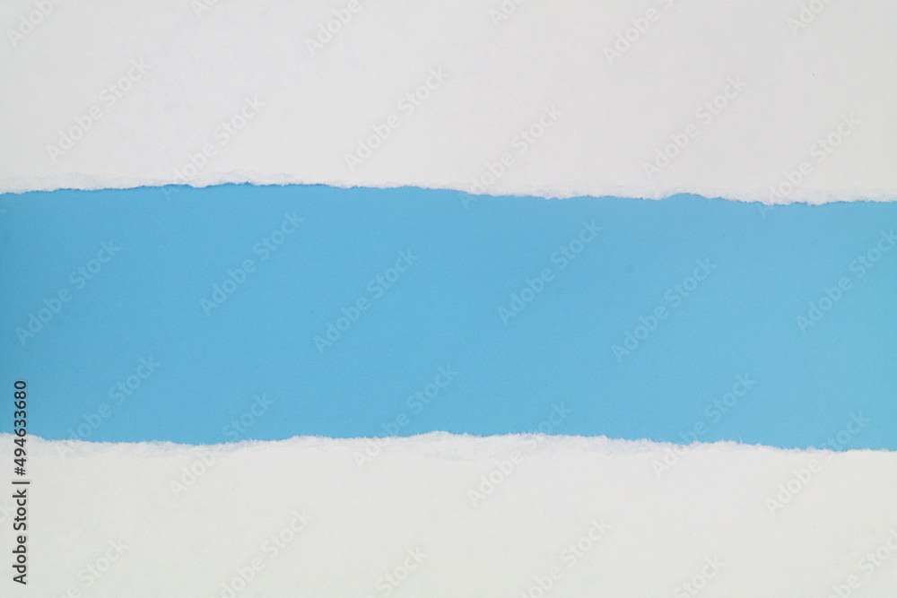 White paper pages on blue background. Copy space for text. White paper pages on blue background. Copy space for text.