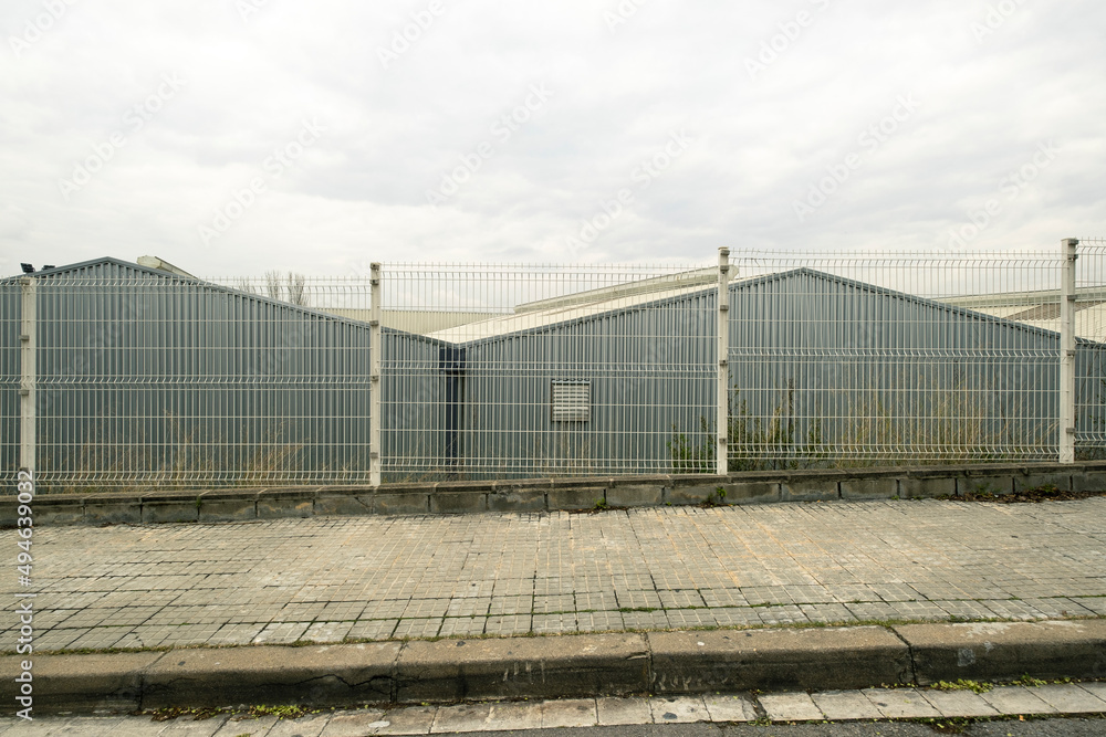 metal facade of a storage building in an industrial landscape metal facade of a storage building in an industrial landscape