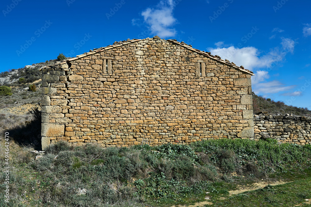 stone wall of abandoned and ruined rural house