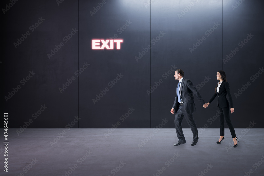 Obraz premium Thoughtful young businessman and woman standing in concrete interior with entrance to success. Way and opportunity concept.
