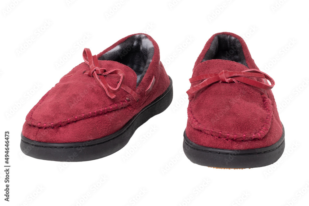 Slippers isolated. Close-up of a pair of female red warm and soft cosy terry house slippers isolated on white background.  Womans shoes. Macro.