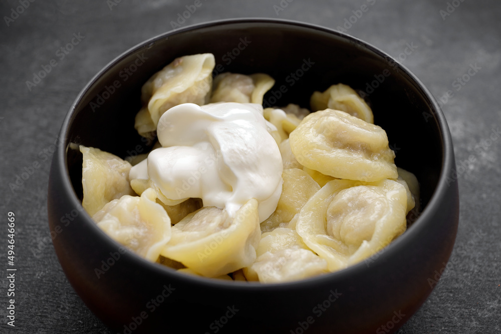 Boiled dumplings with meat in a pot Boiled dumplings with meat in a pot