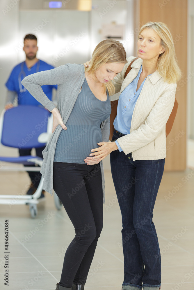 Fototapeta premium young pregnant woman is in pain