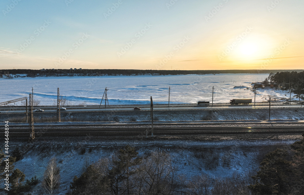 Car road in a small town. Aerial view. Urban scene in winter Car road in a small town. Aerial view. Urban scene in winter
