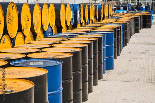 Industry oil barrels or chemical drums stacked up.chemical tank.container of  barrels of hydrocarbons.hazardous waste of black and blue tank oil.