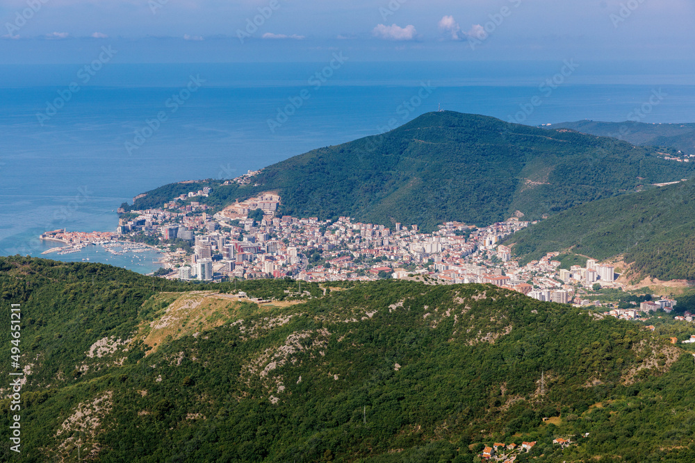 Panoramic view of the city of Budva, Montenegro. Beautiful view from the mountains to the Adriatic Sea. The time of the year is summer.