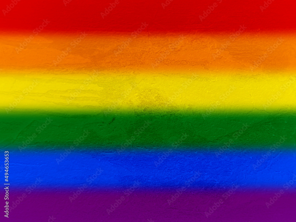 Pride Month and LGBTQ+ motif. Colorful spray on the cement surface of the wall. Graffiti in the colors of the rainbow. Pride Month and LGBTQ+ motif. Colorful spray on the cement surface of the wall. Graffiti in the colors of the rainbow.