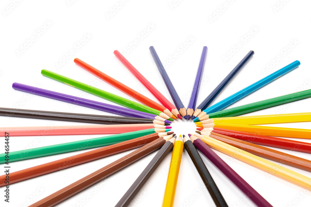 Many multicolored pencils, isolated on white background with copy space. Art and education background.