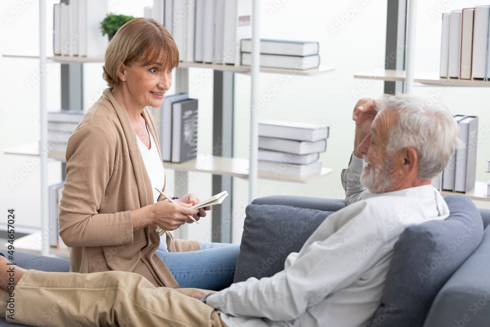 senior woman writing notebook for interview or asking someone senior woman writing notebook for interview or asking someone