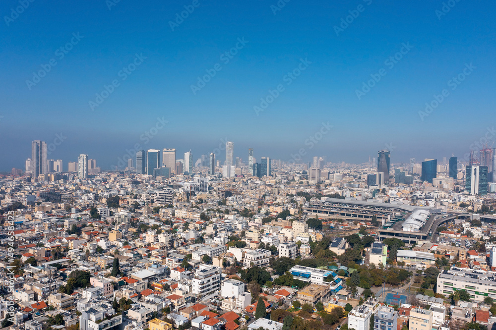 Obraz premium Tel Aviv skyline over neighboring Bnei Brak lower houses, Aerial view.